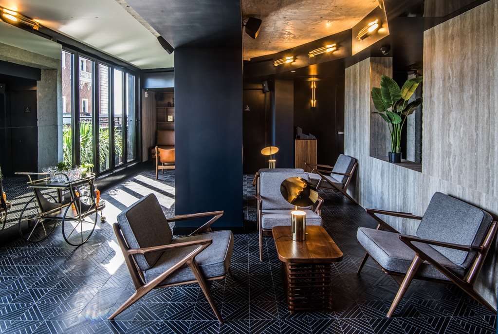 Modern lounge seating at Hotel Henri NYC ideal for guests who stay near Flatiron District NYC